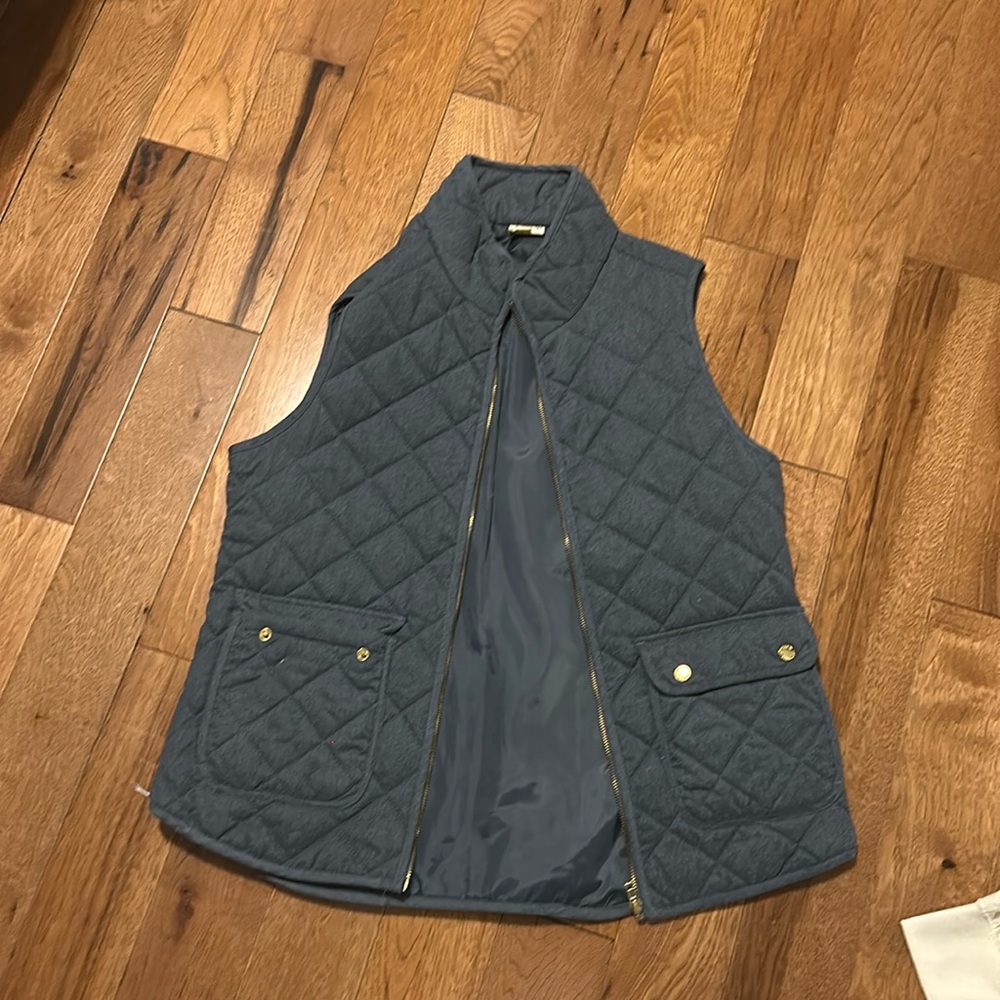 Dark gray/blue Ish vest with gold accents for the buttons and the zipper